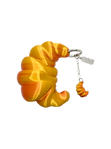 charm cosmic water croissant dorado oscuro